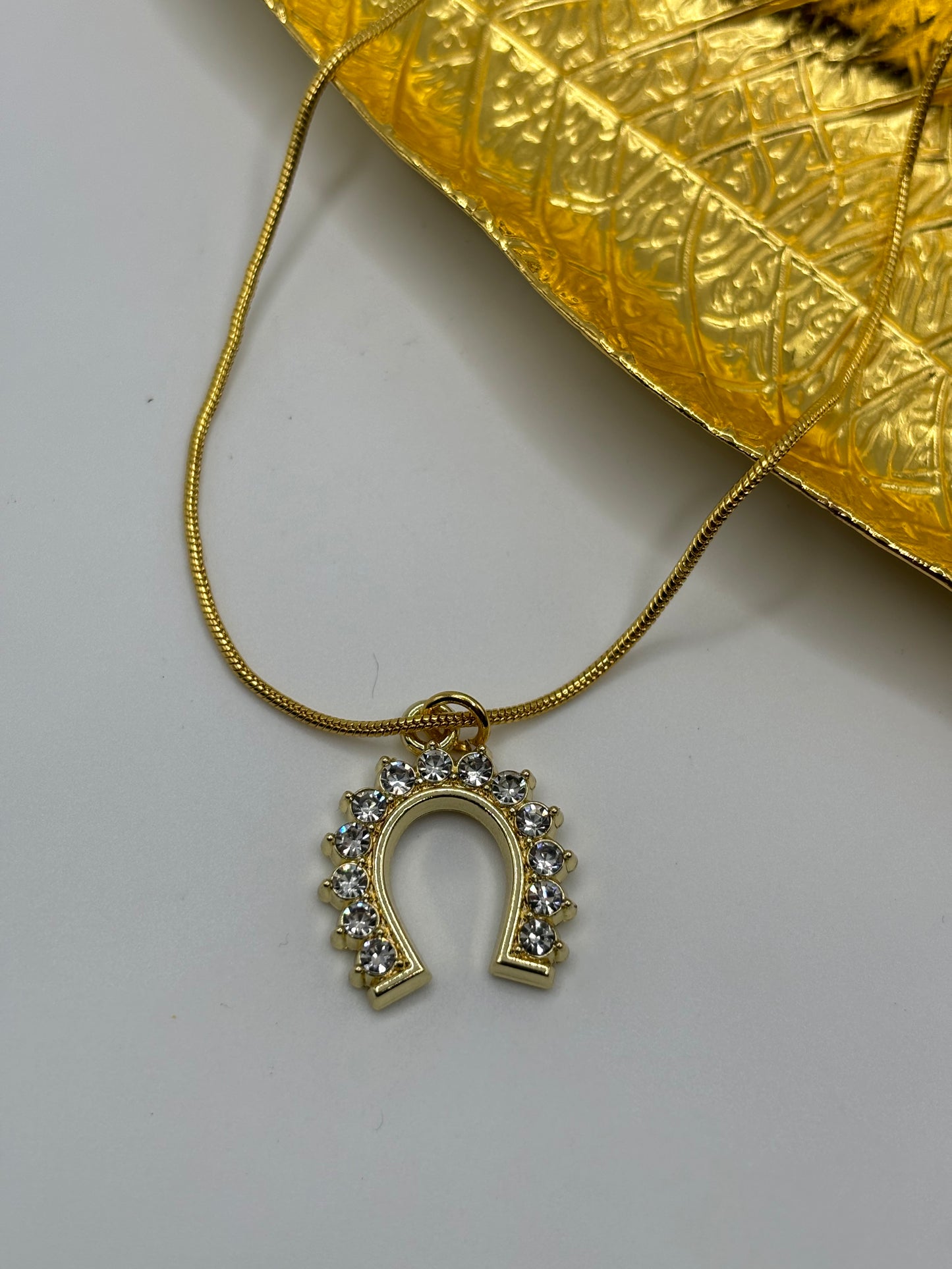 Gold Rhinestone Lucky Horse Shoe Pendant on at 16inch Golden Snake Chain